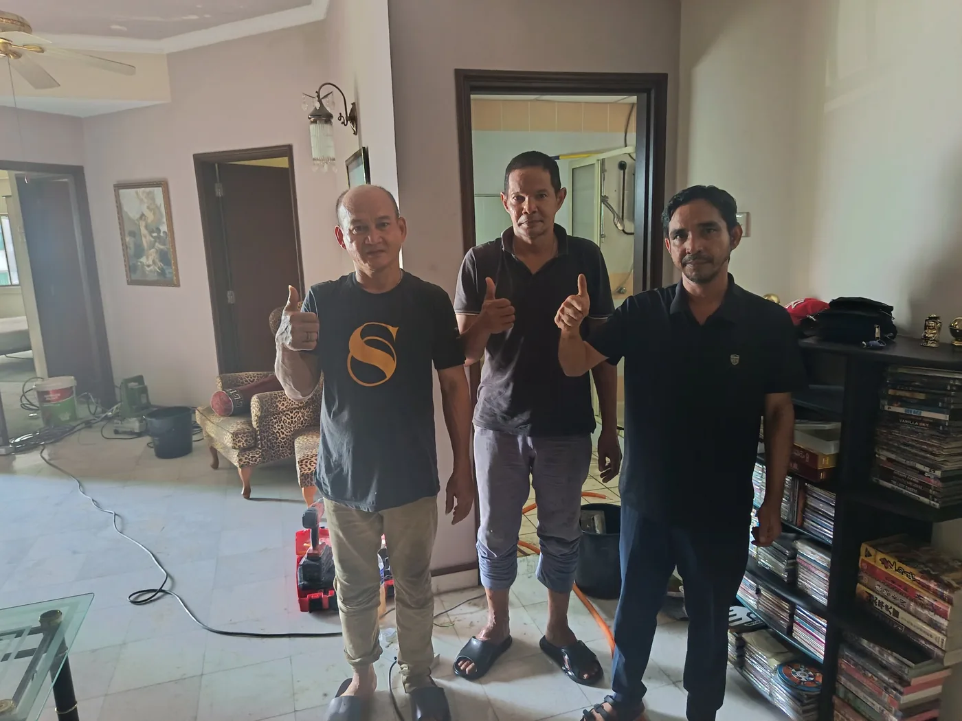 HomePro Services technician with the building manager and the owner after completing E-GEL Micro Injection no-hacking waterproofing at Villa Puteri Kuala Lumpur