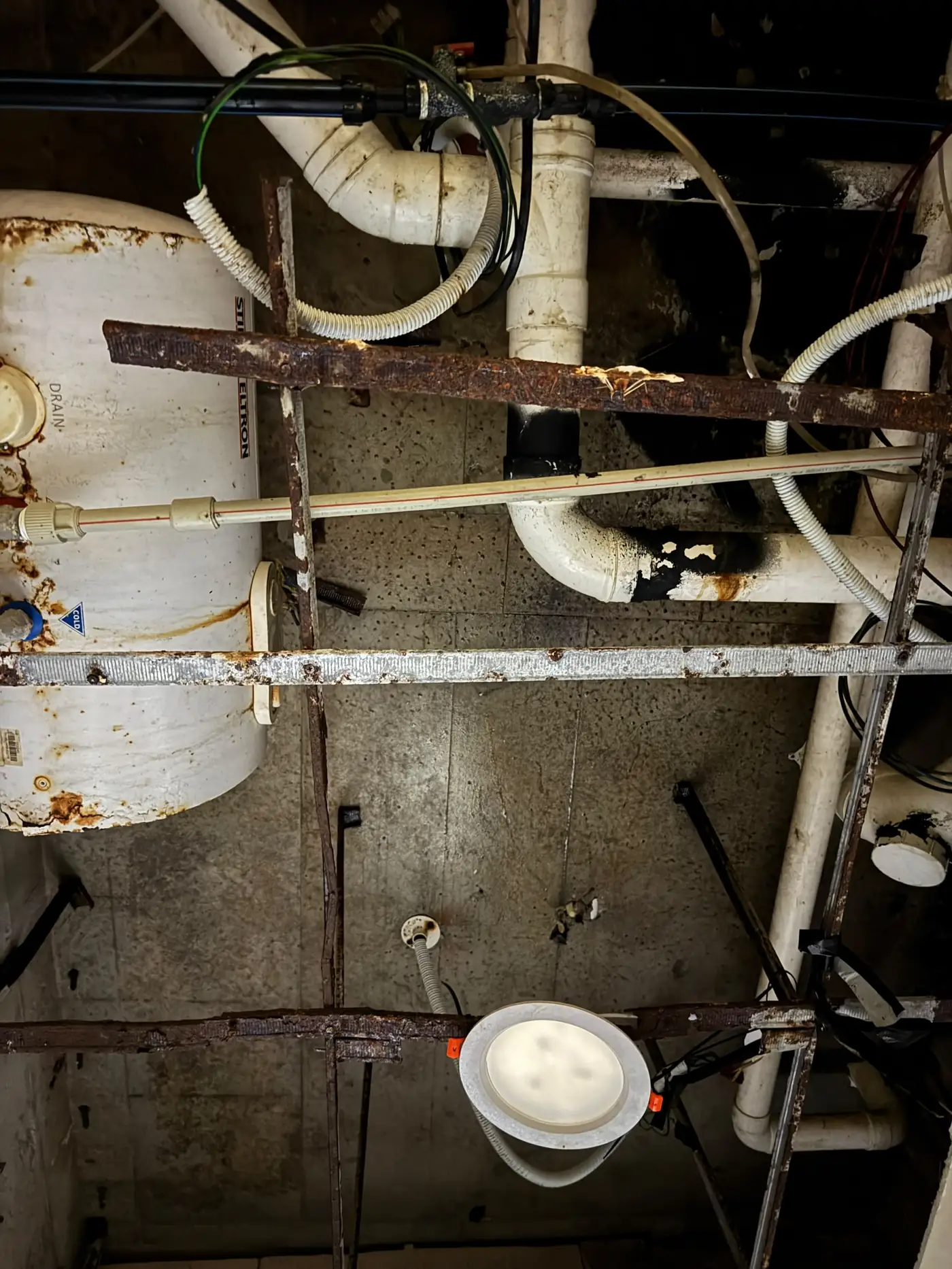 Water-stained concrete floor slab above a condominium false ceiling, Villa Puteri Kuala Lumpur